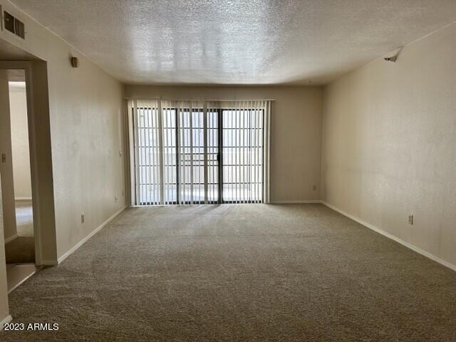 8020 East Thomas Road, Unit 214 Scottsdale, AZ 85251 - Photo 3 of 9 a view of an empty room with a window