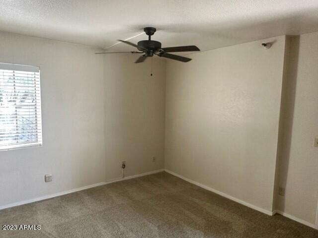 8020 East Thomas Road, Unit 214 Scottsdale, AZ 85251 - Photo 4 of 9 an empty room with a window