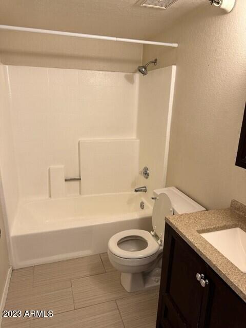 8020 East Thomas Road, Unit 214 Scottsdale, AZ 85251 - Photo 7 of 9 a bathroom with a granite countertop bathtub shower sink vanity and toilet