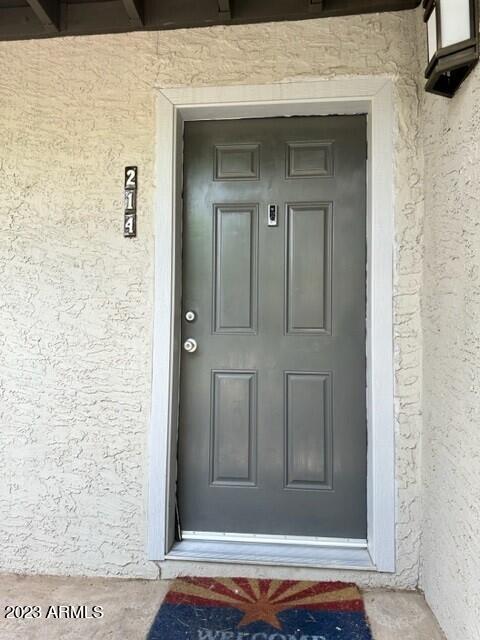 8020 East Thomas Road, Unit 214 Scottsdale, AZ 85251 - Photo 9 of 9 a view of a wooden door