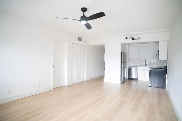 a view of a kitchen with a sink and dishwasher a kitchen view