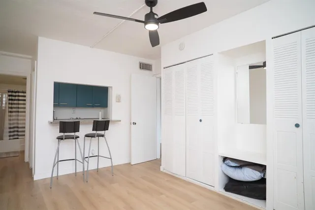 a room with a chair and a flat screen tv