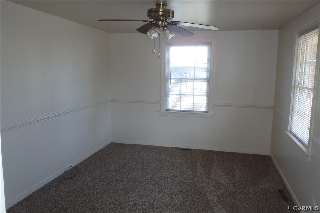 530 Riverview Road Colonial Heights, VA 23834 - Photo 7 of 10 an empty room with a window and a fan