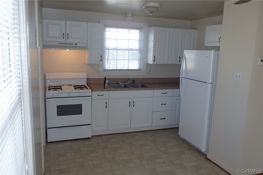 530 Riverview Road Colonial Heights, VA 23834 - Photo 8 of 10 a kitchen with granite countertop white cabinets and white appliances