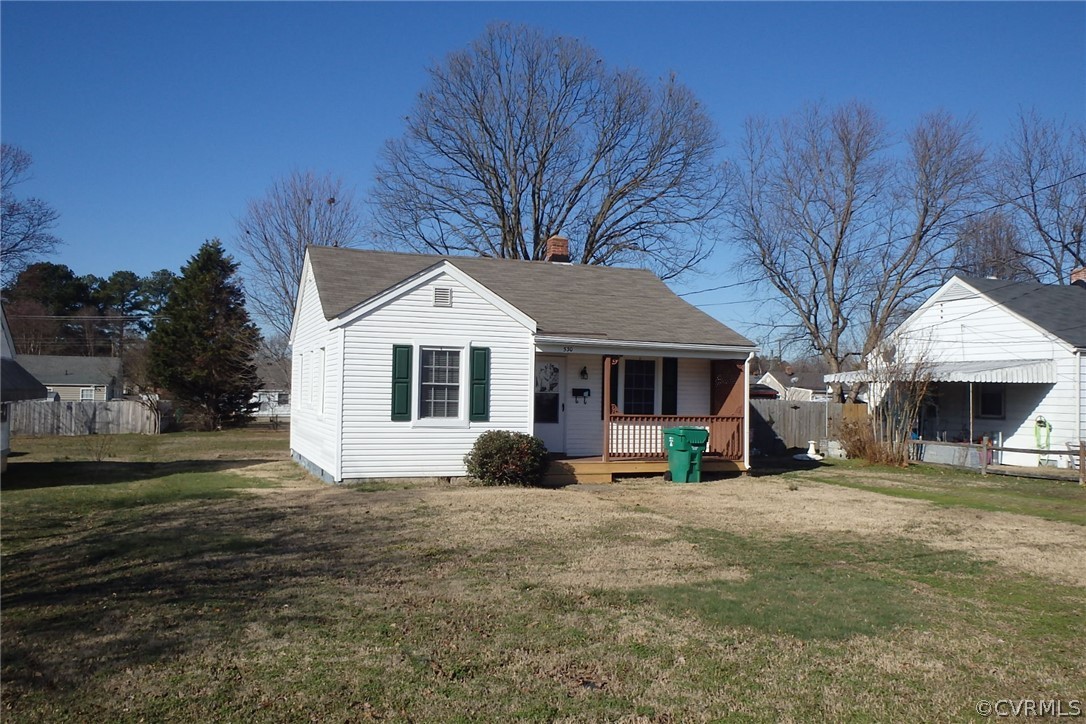 530 Riverview Road Colonial Heights, VA 23834 - Photo 10 of 10 a view of a white house with a big yard and large trees