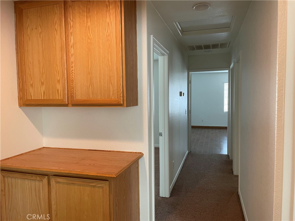 12661 Luna Road Victorville, CA 92392 - Photo 15 of 20 a view of a storage and utility room with a sink