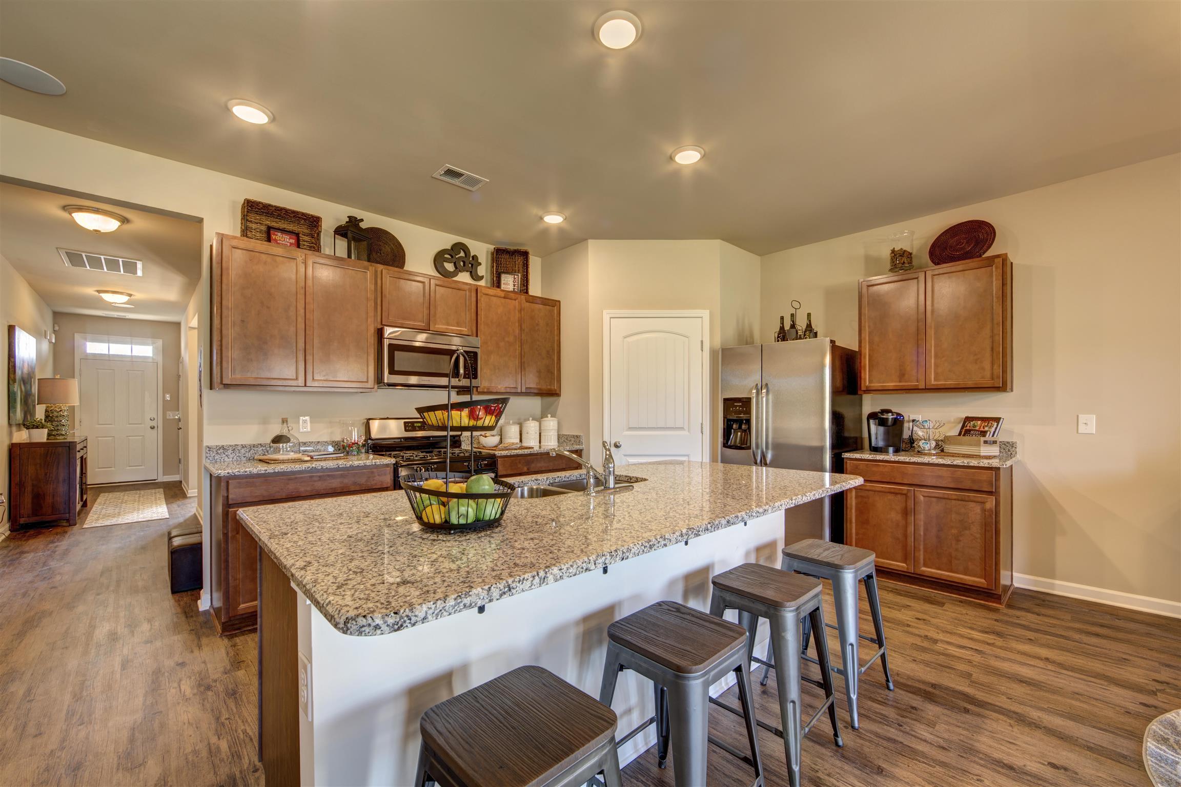 776 Prominence Road, Unit 82 Columbia, TN 38401 - Photo 1 of 18 a kitchen with stainless steel appliances granite countertop a sink stove and refrigerator