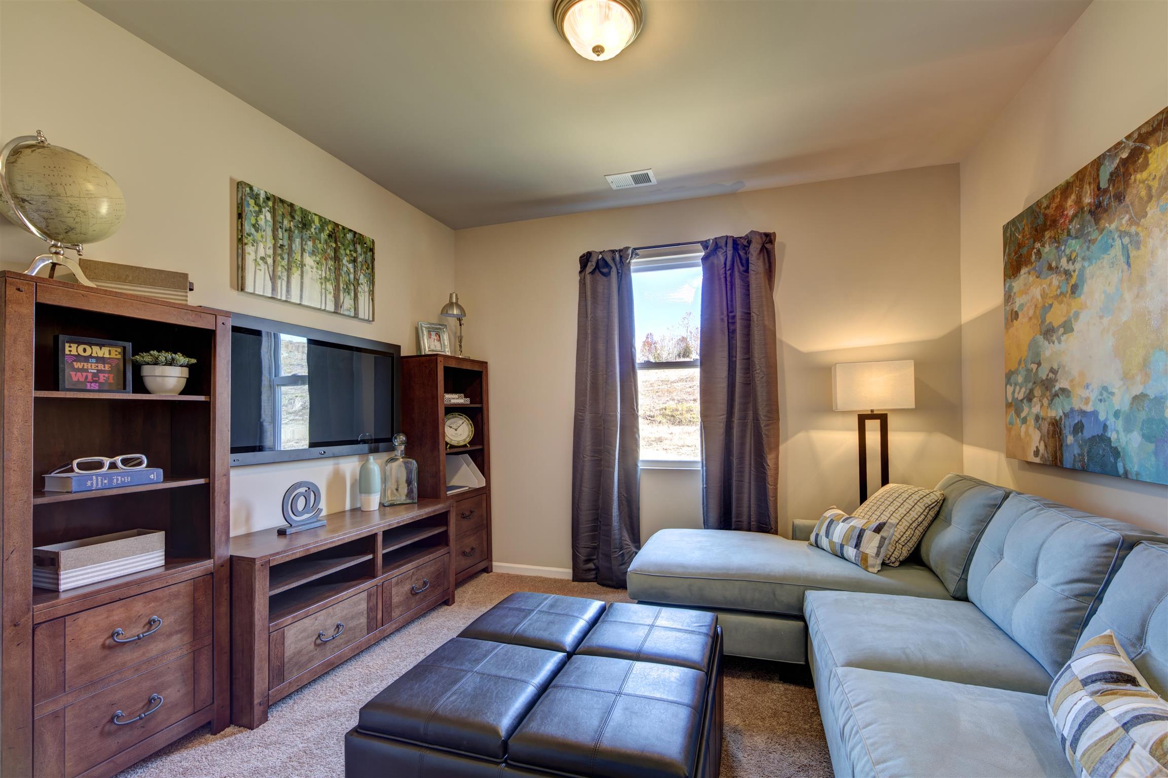 776 Prominence Road, Unit 82 Columbia, TN 38401 - Photo 14 of 18 a bedroom with furniture and a lamp