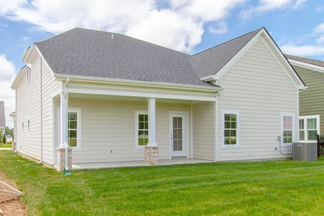 a view of a house with a backyard