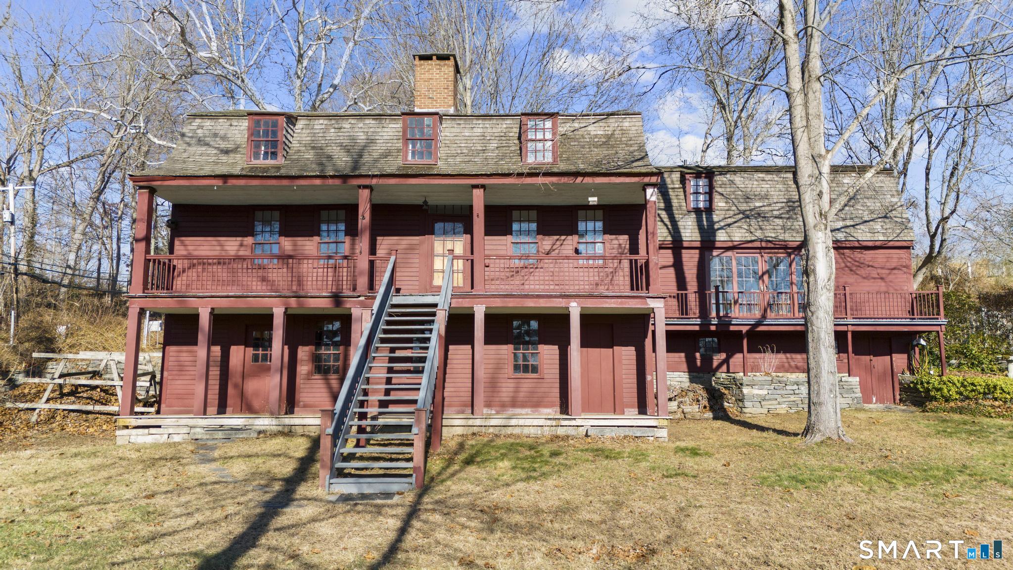 a front view of a house with large windows