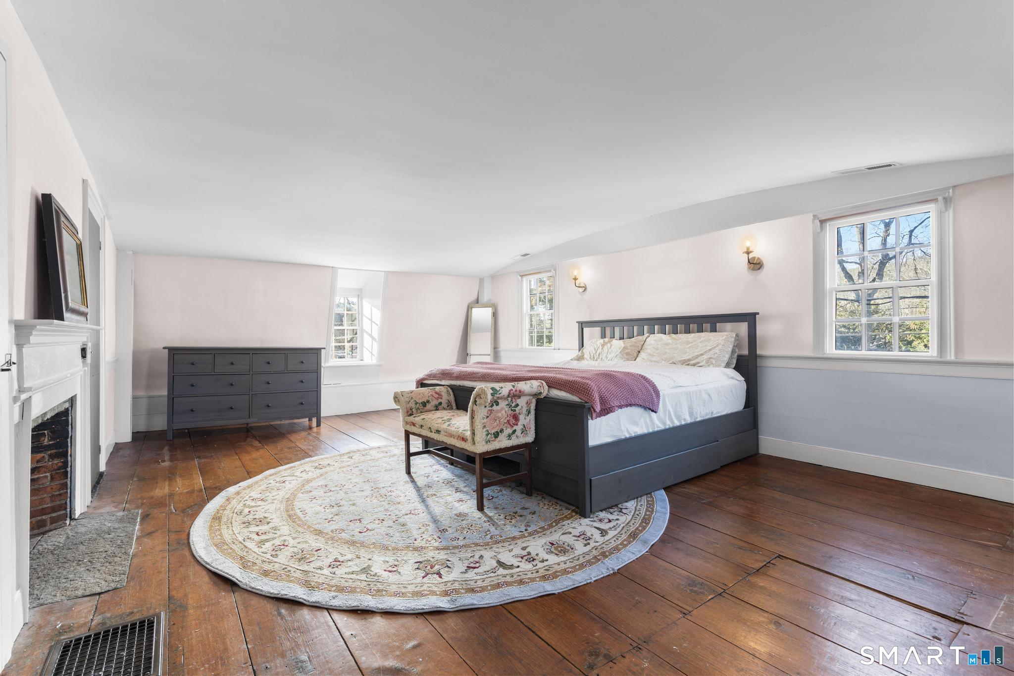 1 Ferry Road Chester, CT 06412 - Photo 17 of 40 a living room with furniture a fireplace and a table