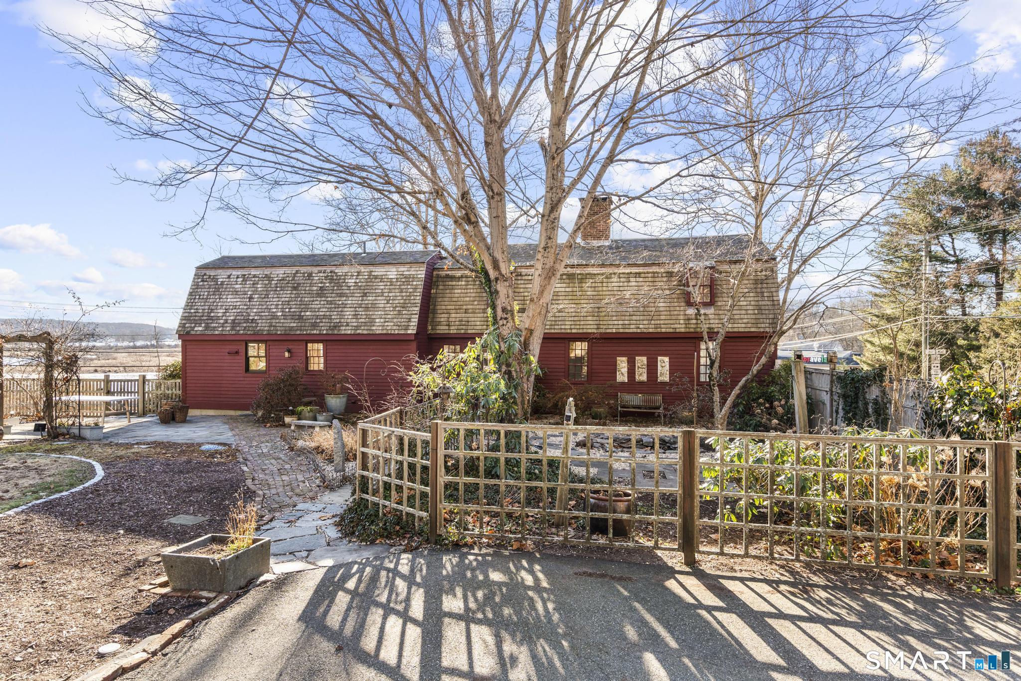 1 Ferry Road Chester, CT 06412 - Photo 2 of 40 a view of a brick house with many windows