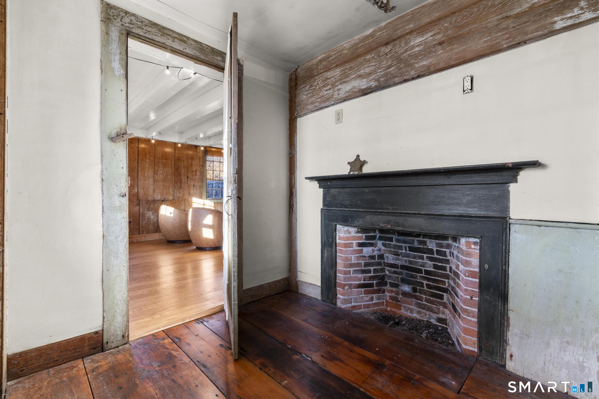 1 Ferry Road Chester, CT 06412 - Photo 29 of 40 a view of a livingroom with wooden floor and a fireplace