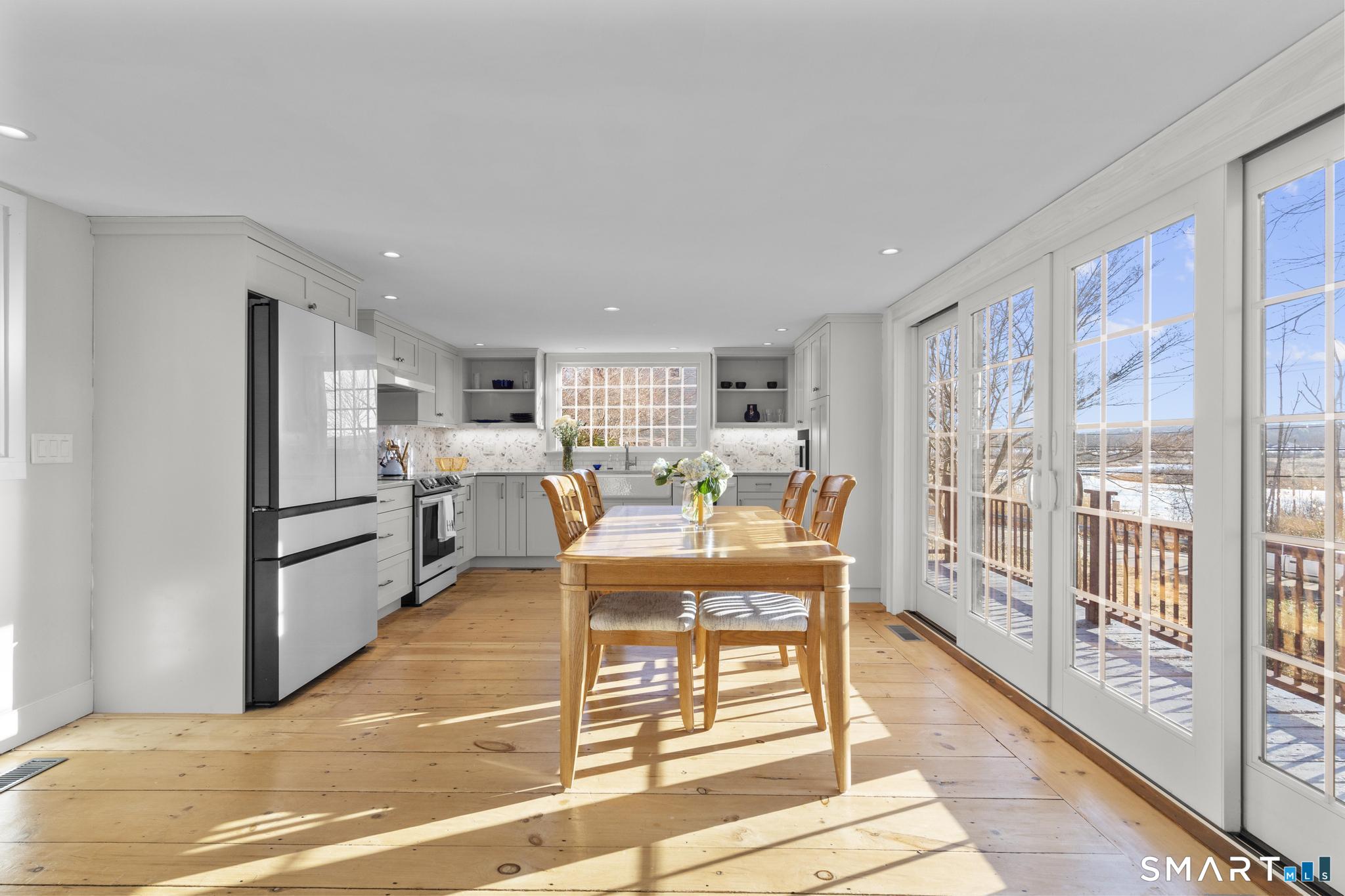 1 Ferry Road Chester, CT 06412 - Photo 3 of 40 a view of a dining room with furniture a rug and wooden floor