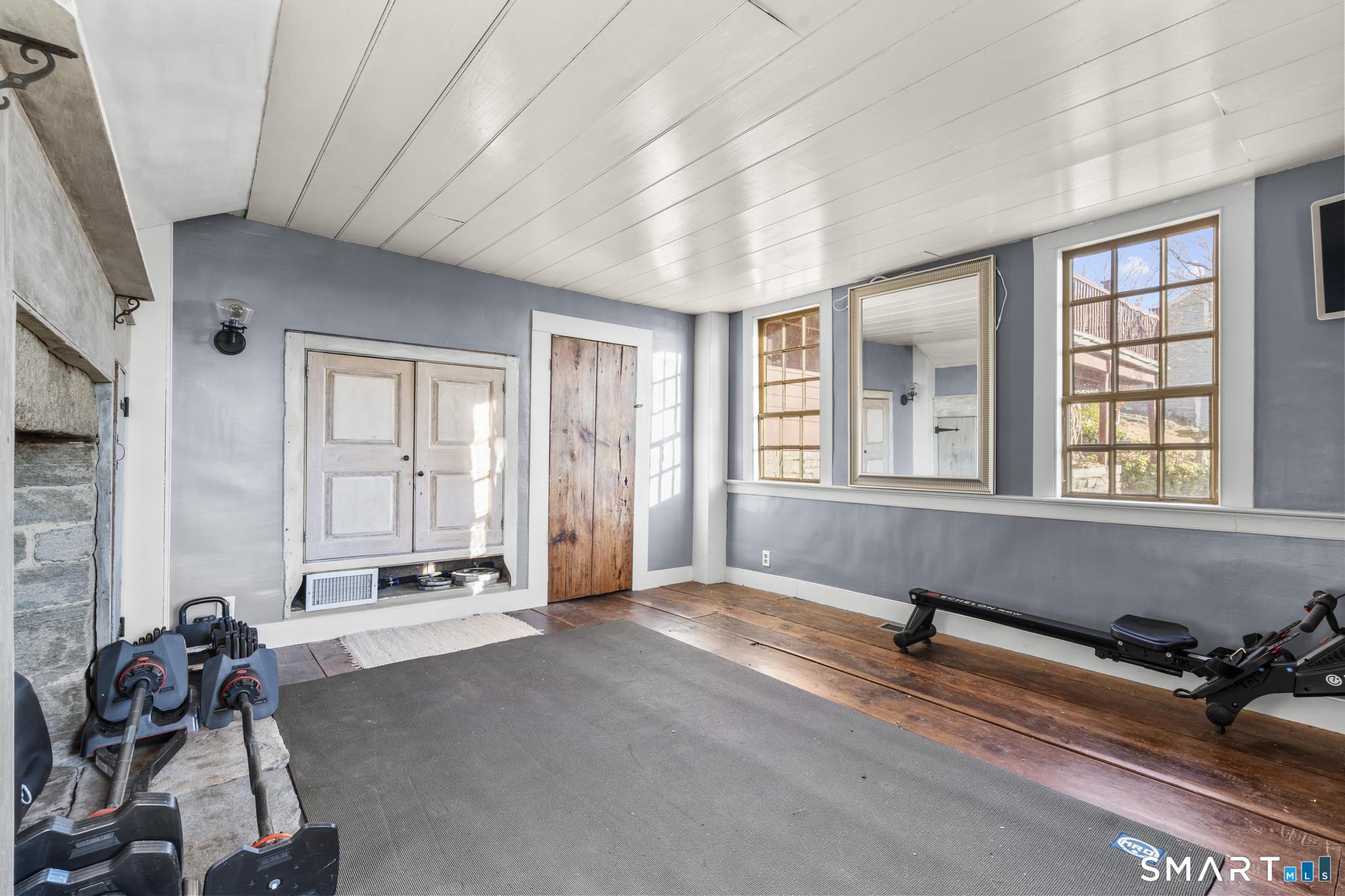 1 Ferry Road Chester, CT 06412 - Photo 31 of 40 a view of a room with gym equipment and windows
