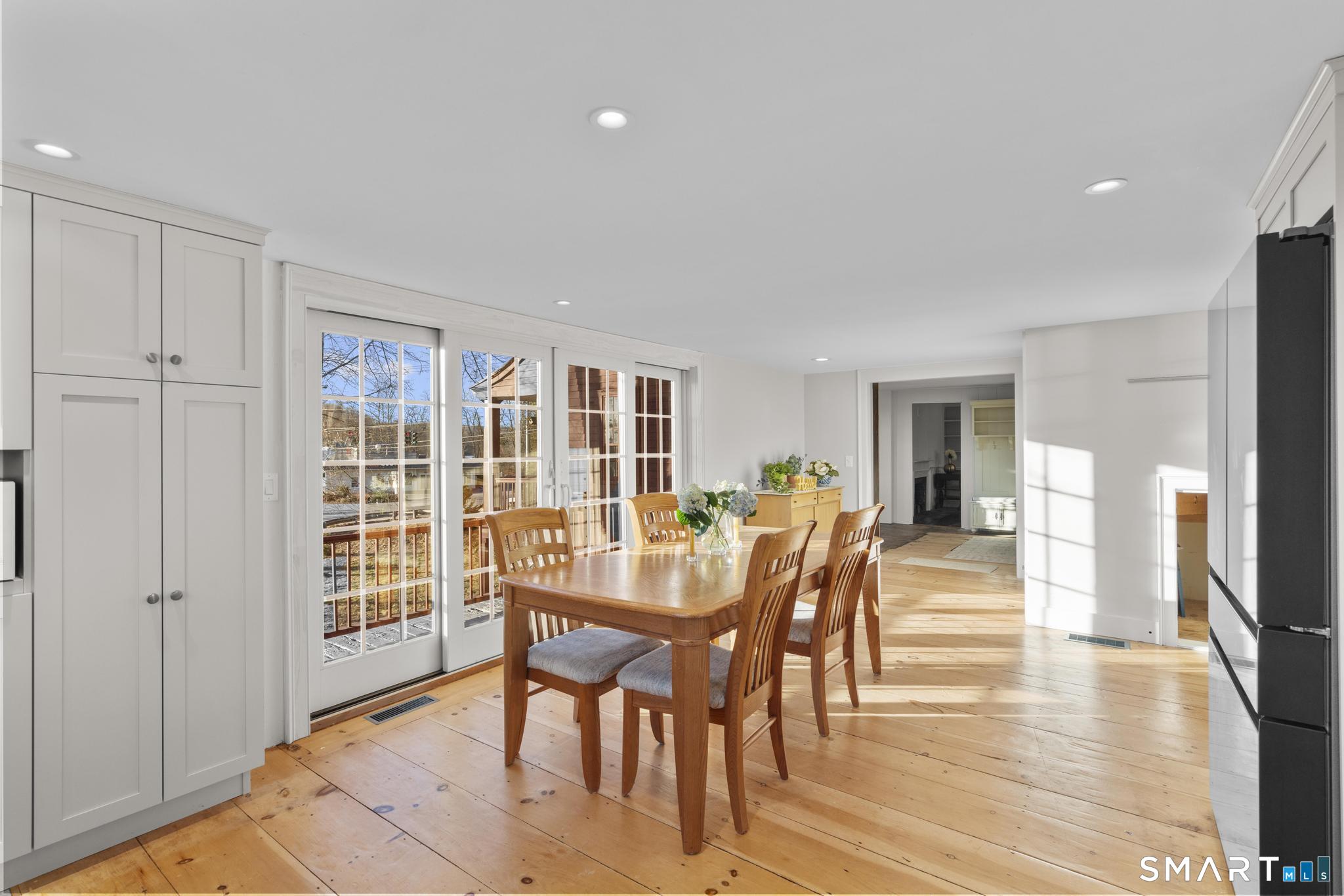 1 Ferry Road Chester, CT 06412 - Photo 6 of 40 a view of a dining room with furniture and wooden floor