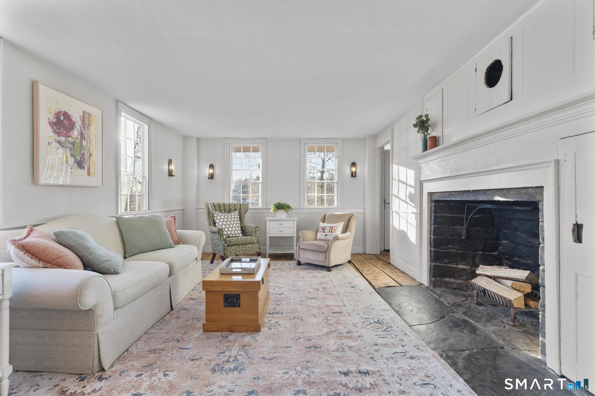 1 Ferry Road Chester, CT 06412 - Photo 7 of 40 a living room with furniture and a fireplace
