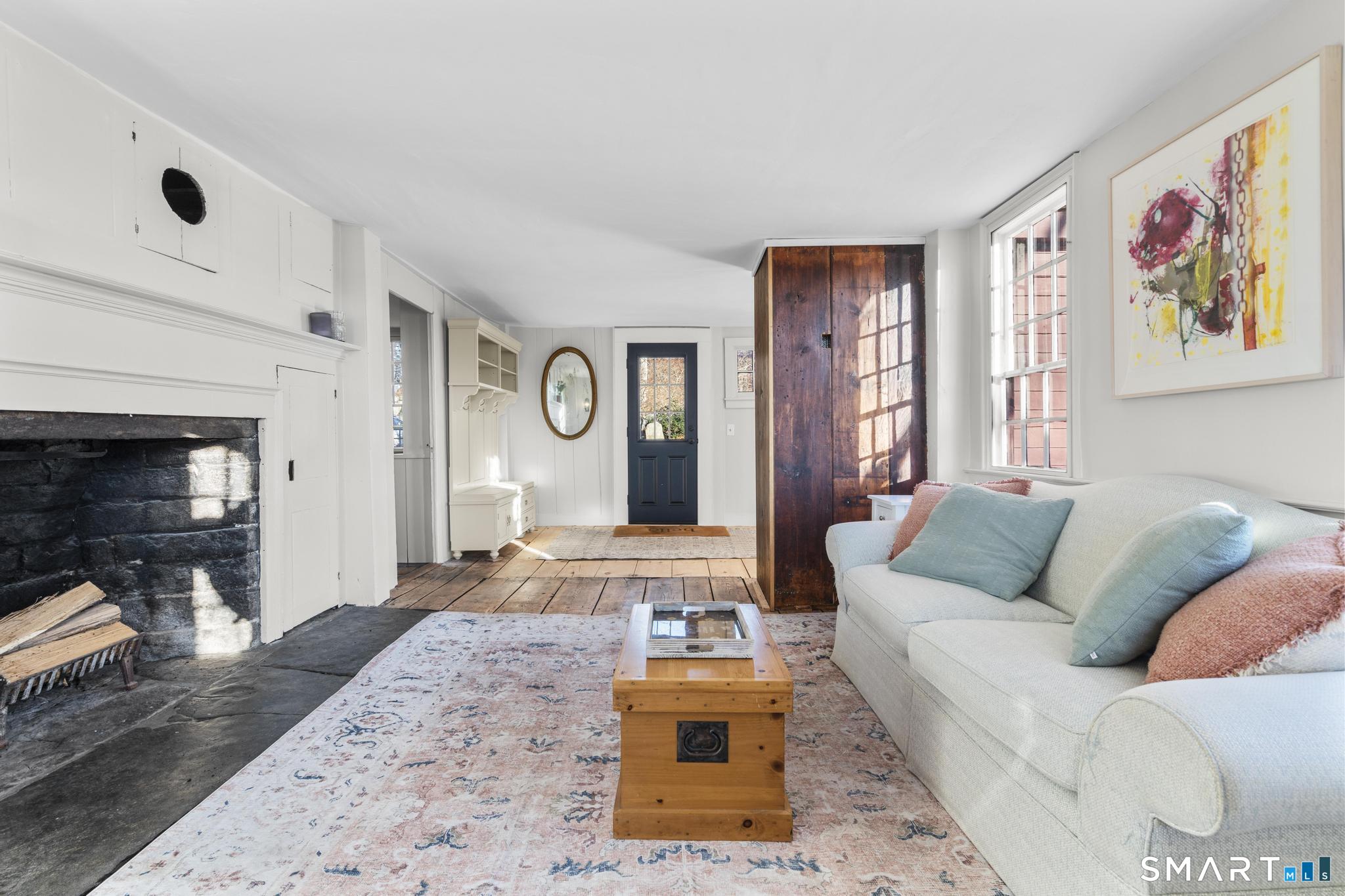 1 Ferry Road Chester, CT 06412 - Photo 8 of 40 a living room with furniture and a fireplace