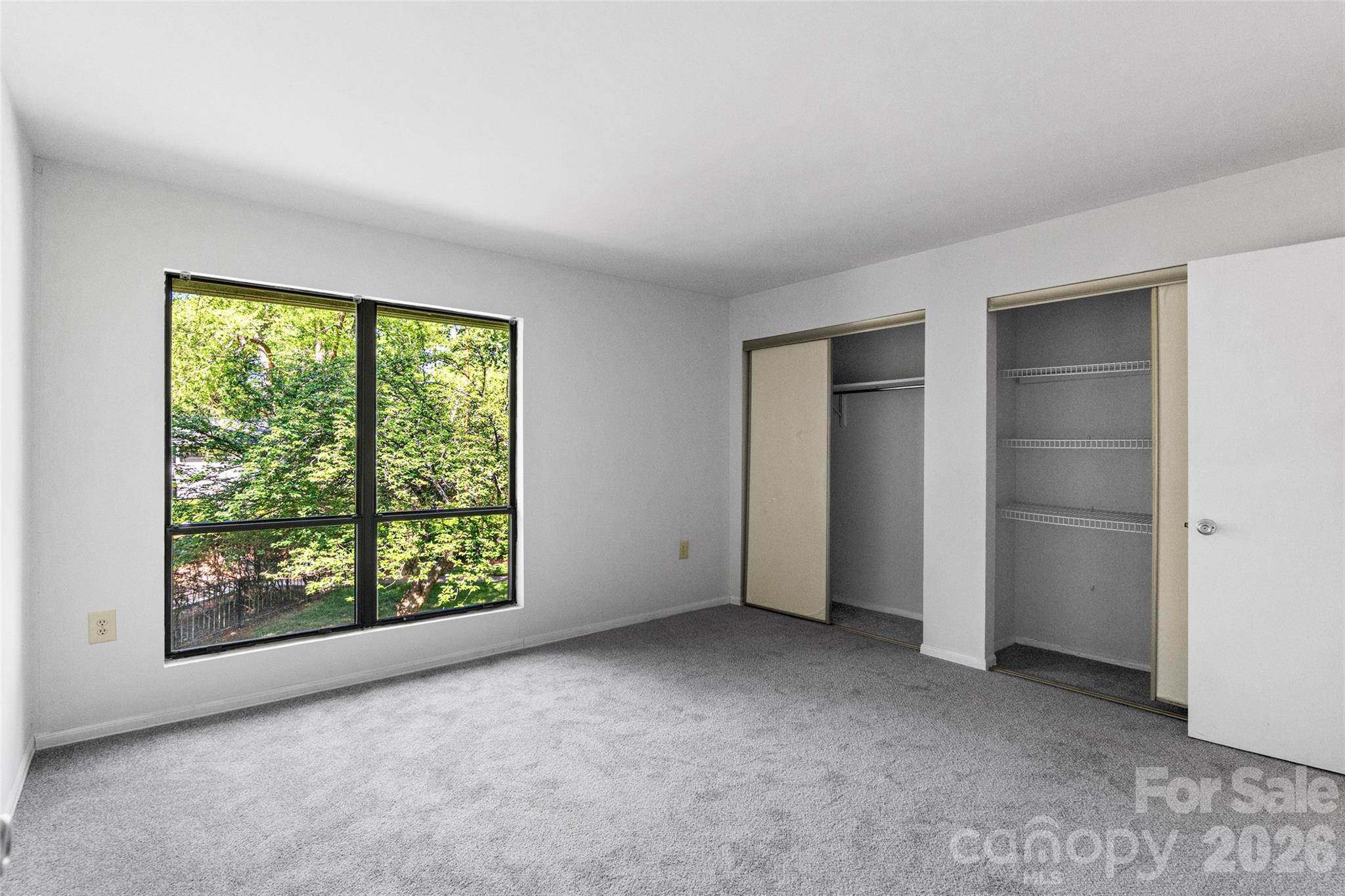 5016 Sardis Road, Unit C Charlotte, NC 28270 - Photo 11 of 25 an empty room with windows and closet