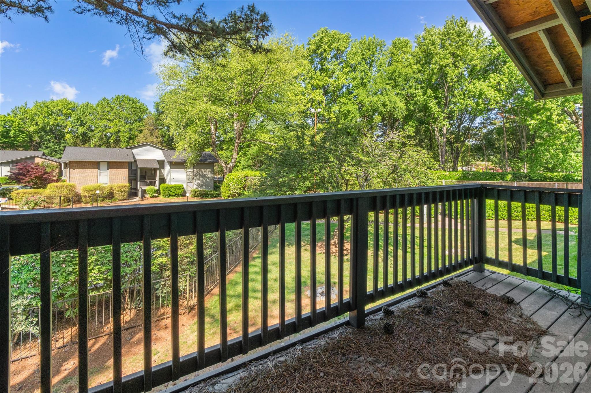 5016 Sardis Road, Unit C Charlotte, NC 28270 - Photo 20 of 25 a balcony with trees in front of it