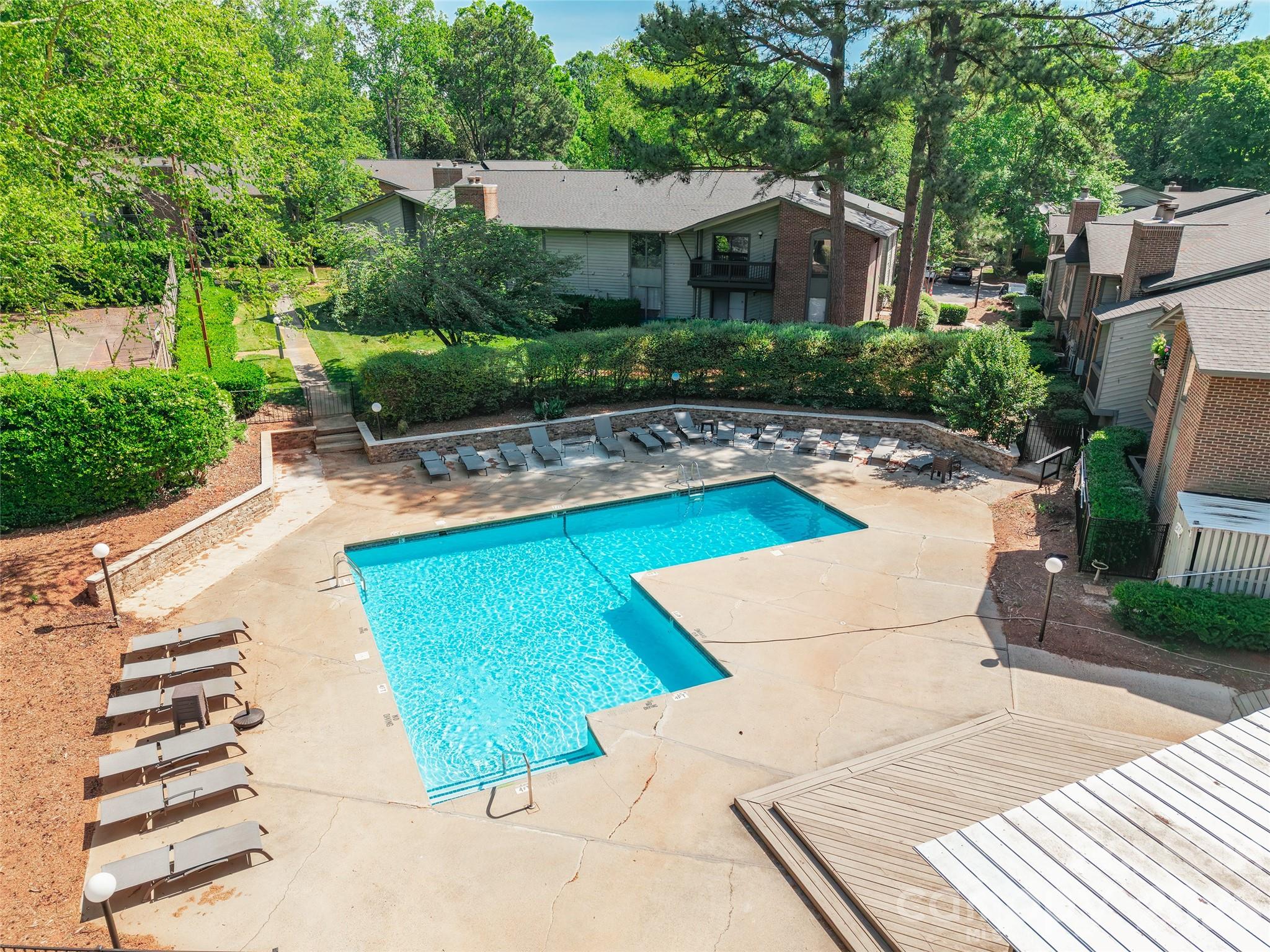 5016 Sardis Road, Unit C Charlotte, NC 28270 - Photo 24 of 25 a view of a house with backyard sitting area and swimming pool