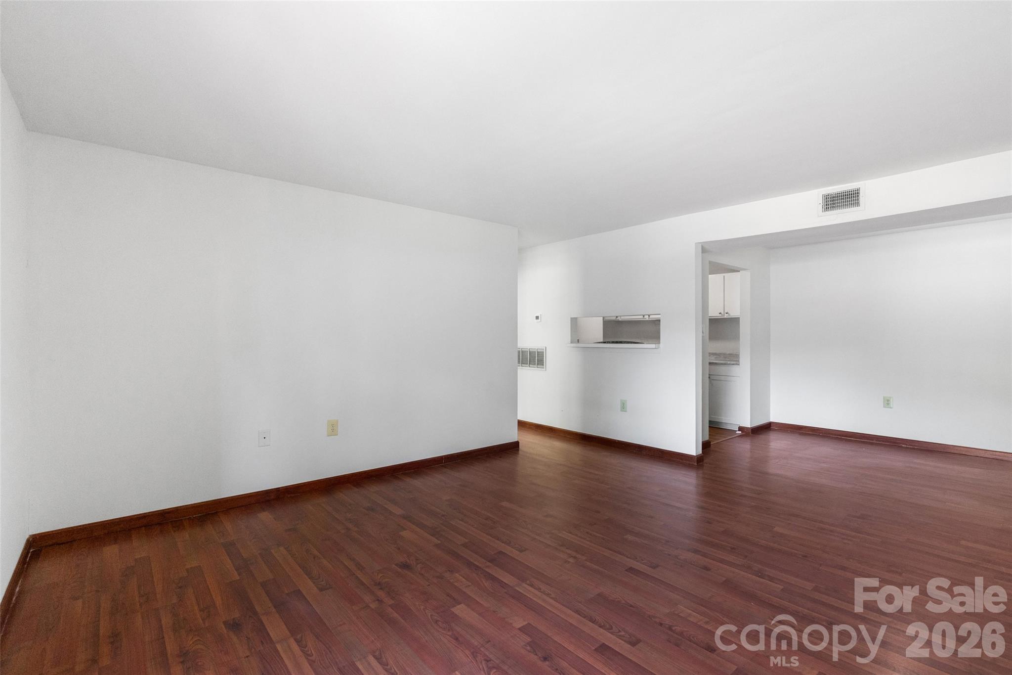 5016 Sardis Road, Unit C Charlotte, NC 28270 - Photo 4 of 25 a view of an empty room and wooden floor