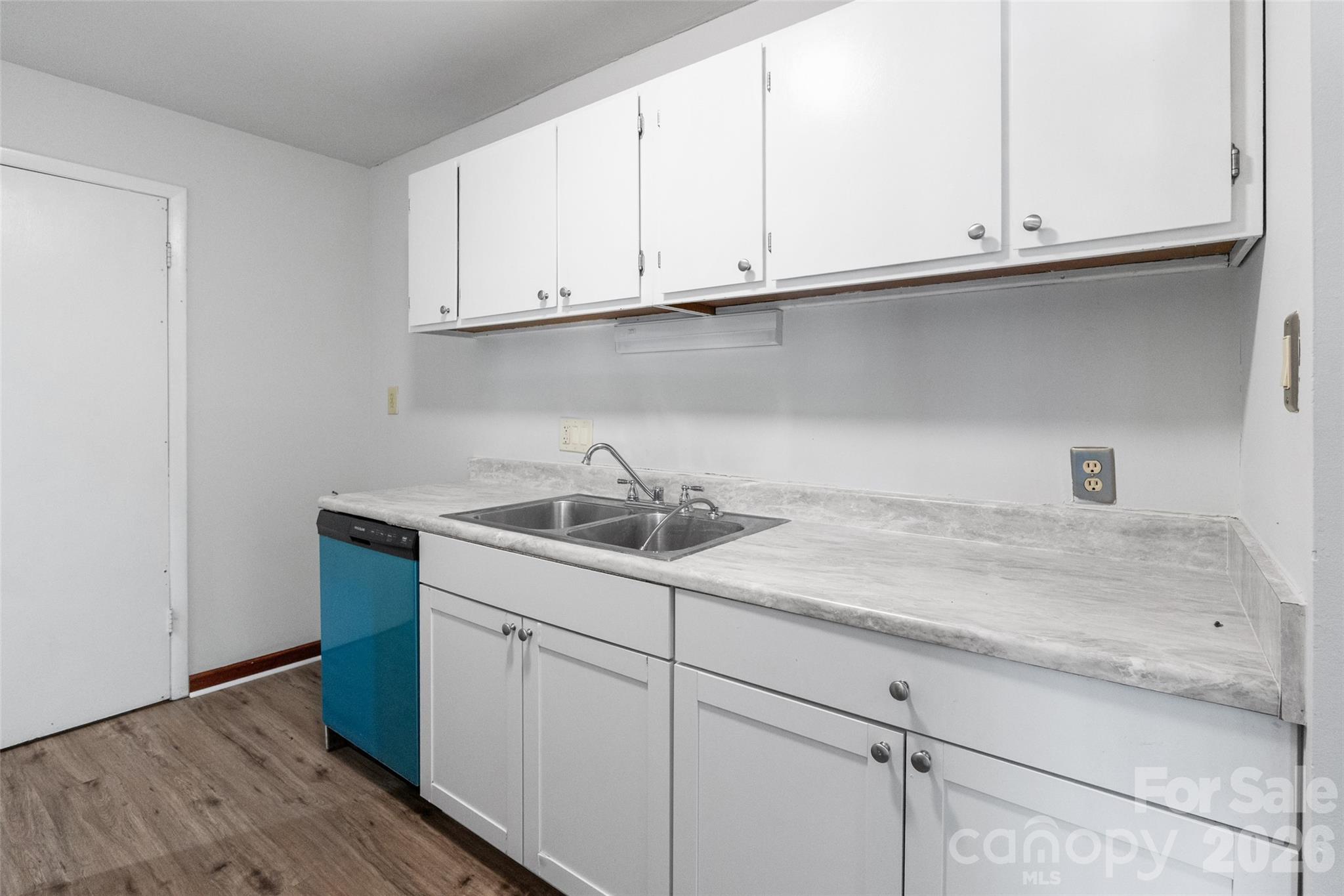 5016 Sardis Road, Unit C Charlotte, NC 28270 - Photo 8 of 25 a kitchen with a sink and cabinets