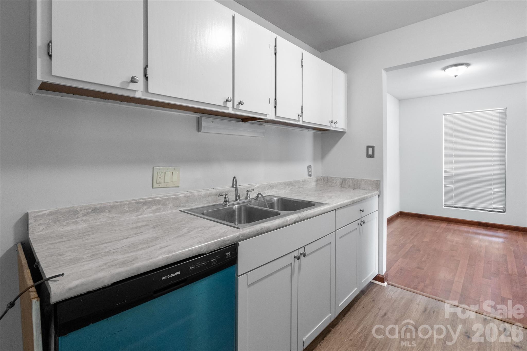 5016 Sardis Road, Unit C Charlotte, NC 28270 - Photo 10 of 25 a kitchen with granite countertop a sink a stove and cabinets