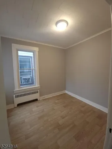 an empty room with a empty space and windows