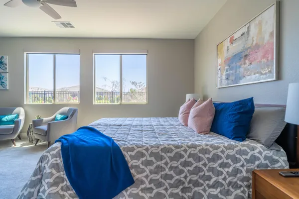 a bedroom with bed and window
