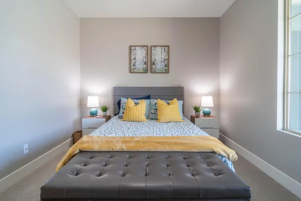 a bedroom with a bed and window