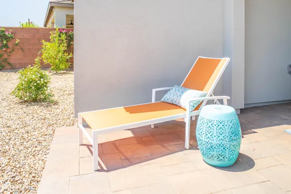 a view of a swimming pool with a lounge chair