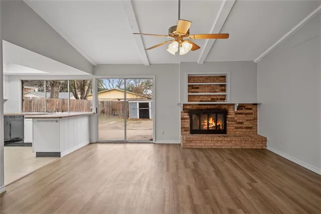 a view of a livingroom with wooden floor