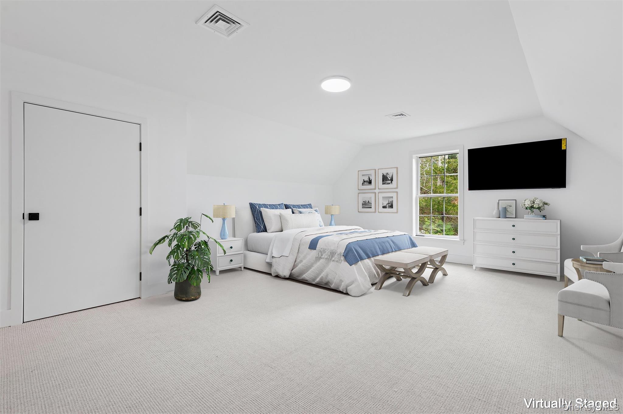 4056 Noyack Road Sag Harbor, NY 11963 - Photo 16 of 21 a living room with furniture and a flat screen tv