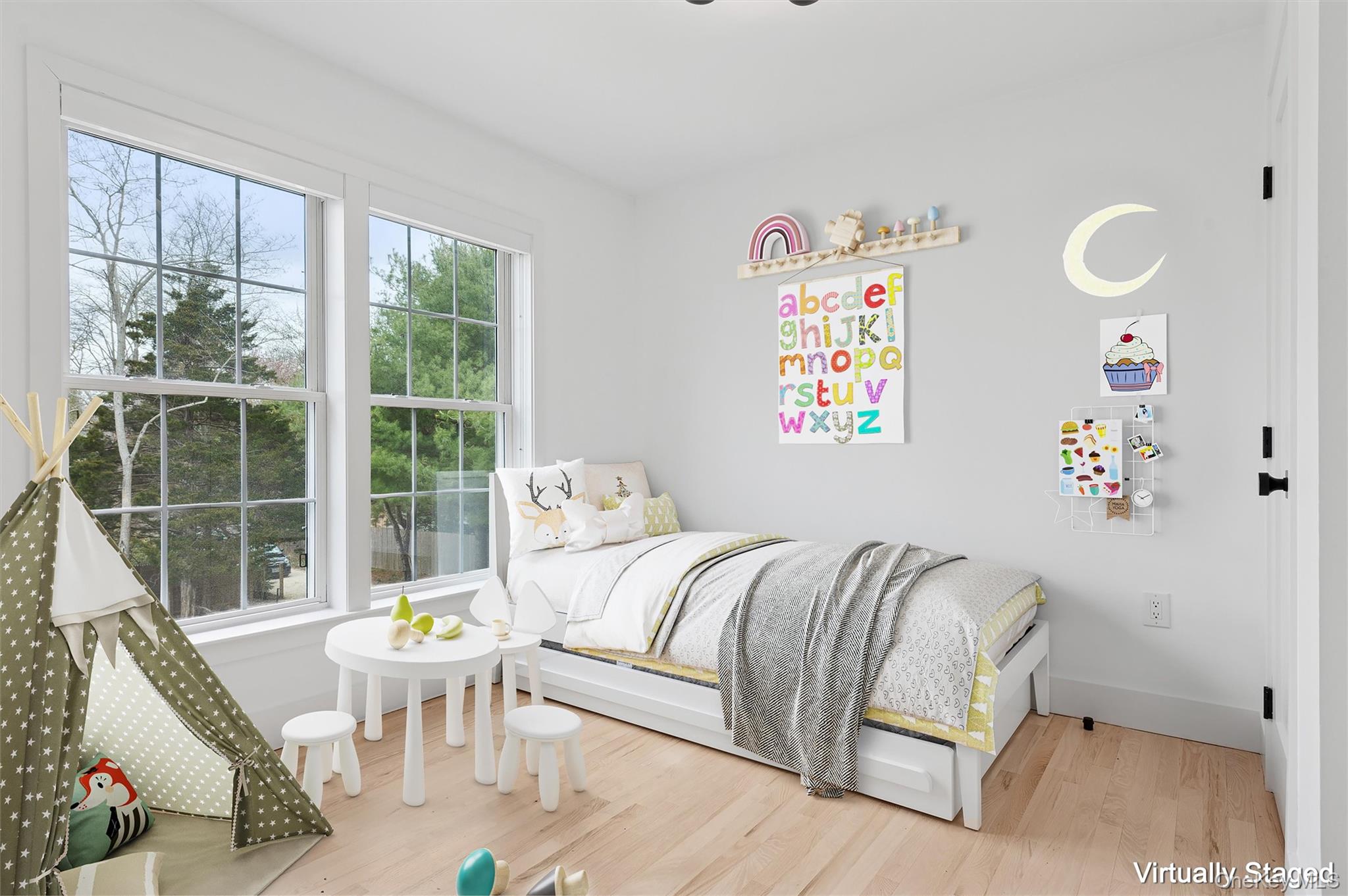 4056 Noyack Road Sag Harbor, NY 11963 - Photo 17 of 21 a bedroom with a bed and wooden floor