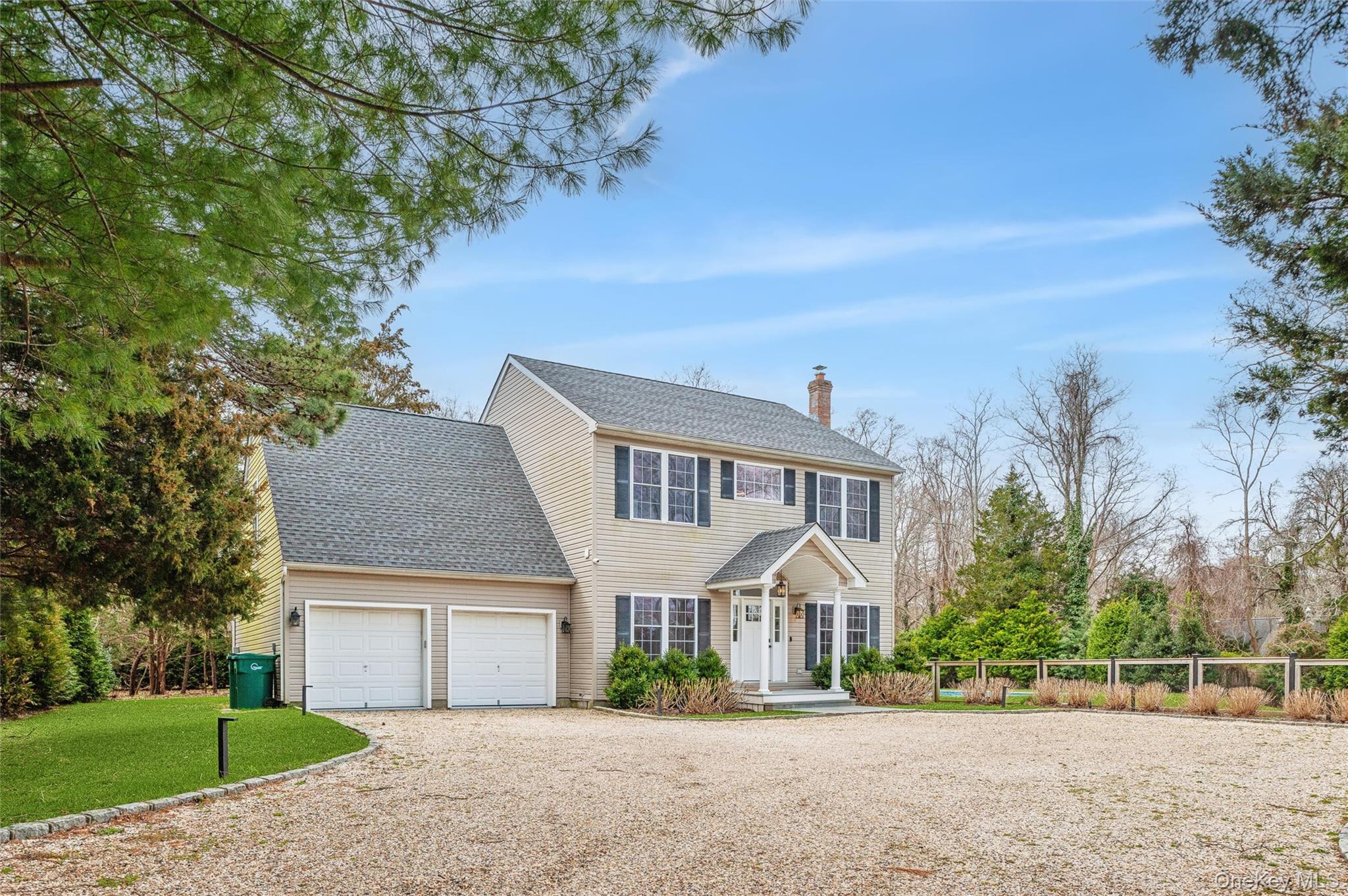 4056 Noyack Road Sag Harbor, NY 11963 - Photo 19 of 21 front view of a house with a yard