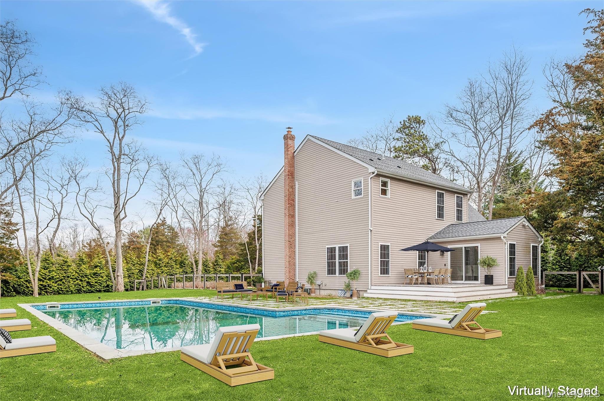4056 Noyack Road Sag Harbor, NY 11963 - Photo 21 of 21 a view of a house with pool and a yard