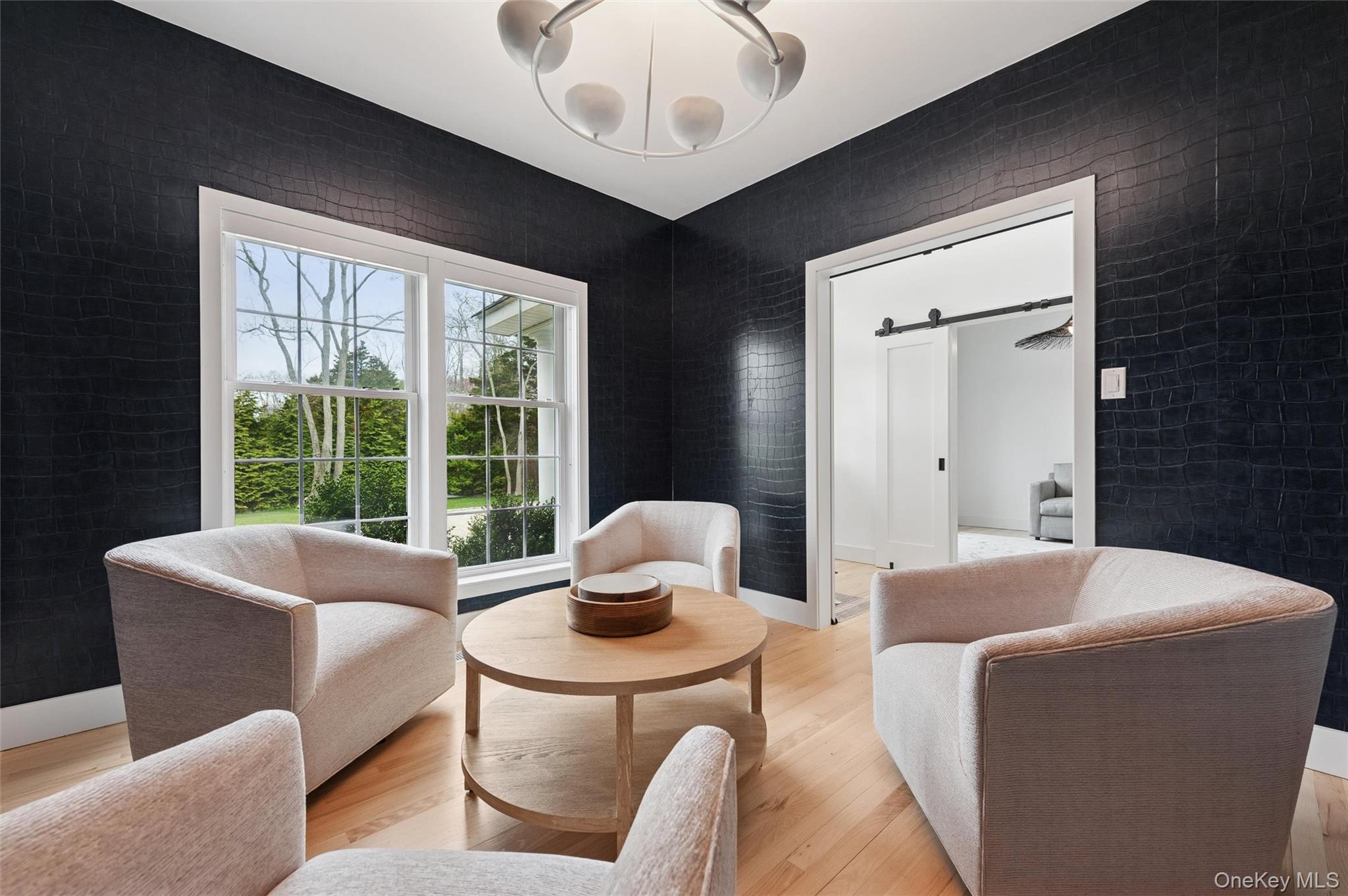 4056 Noyack Road Sag Harbor, NY 11963 - Photo 4 of 21 a living room with furniture and a large window