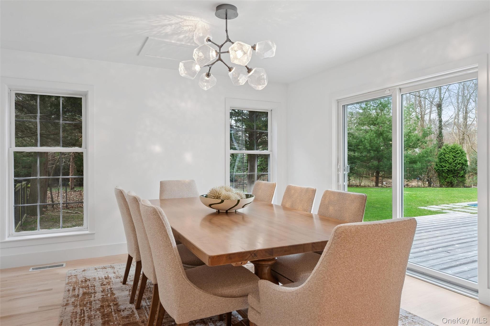4056 Noyack Road Sag Harbor, NY 11963 - Photo 6 of 21 a view of a dining room with furniture window and outside view