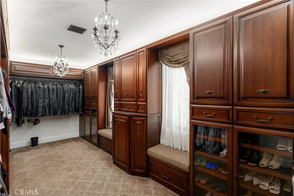 a bedroom with a bed and large window