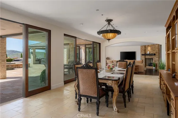a living room with fireplace furniture and a flat screen tv
