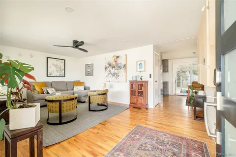a living room with lots of furniture and a rug