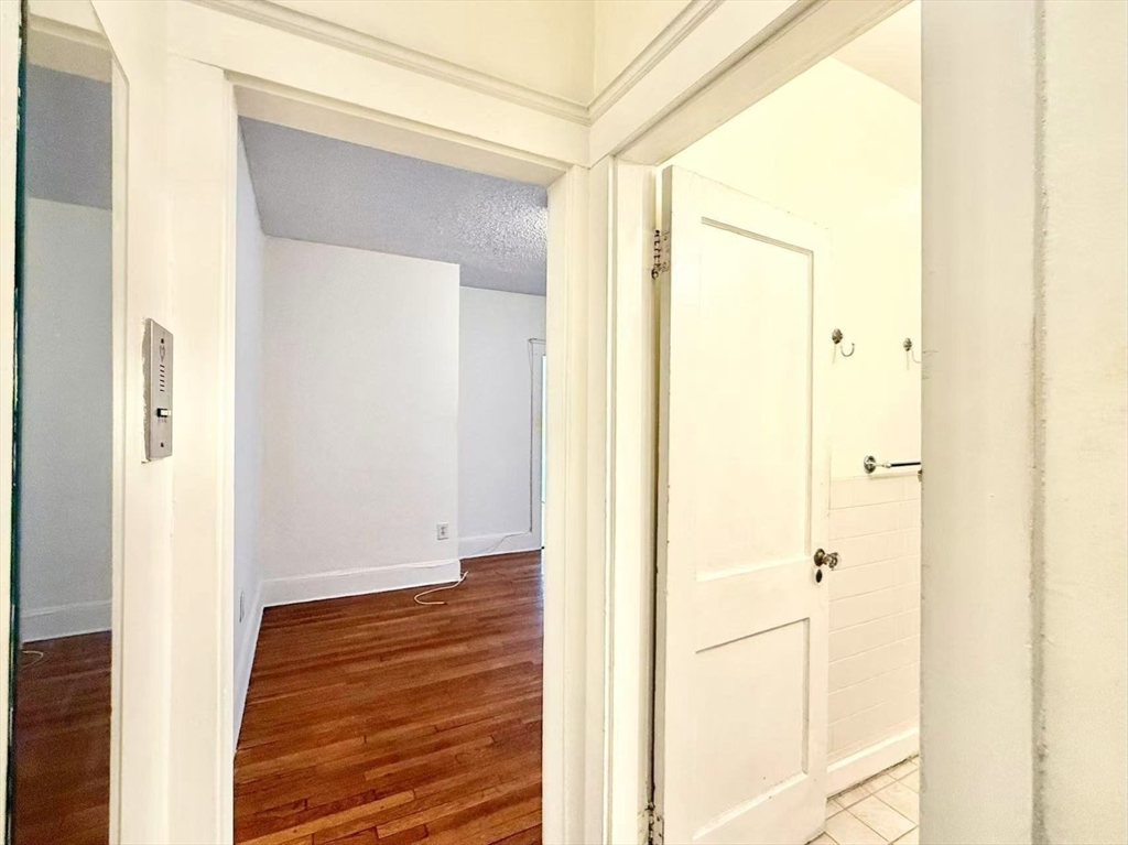 26 Chiswick Road, Unit 6 Boston, MA 02135 - Photo 14 of 19 a view of a hallway with wooden floor