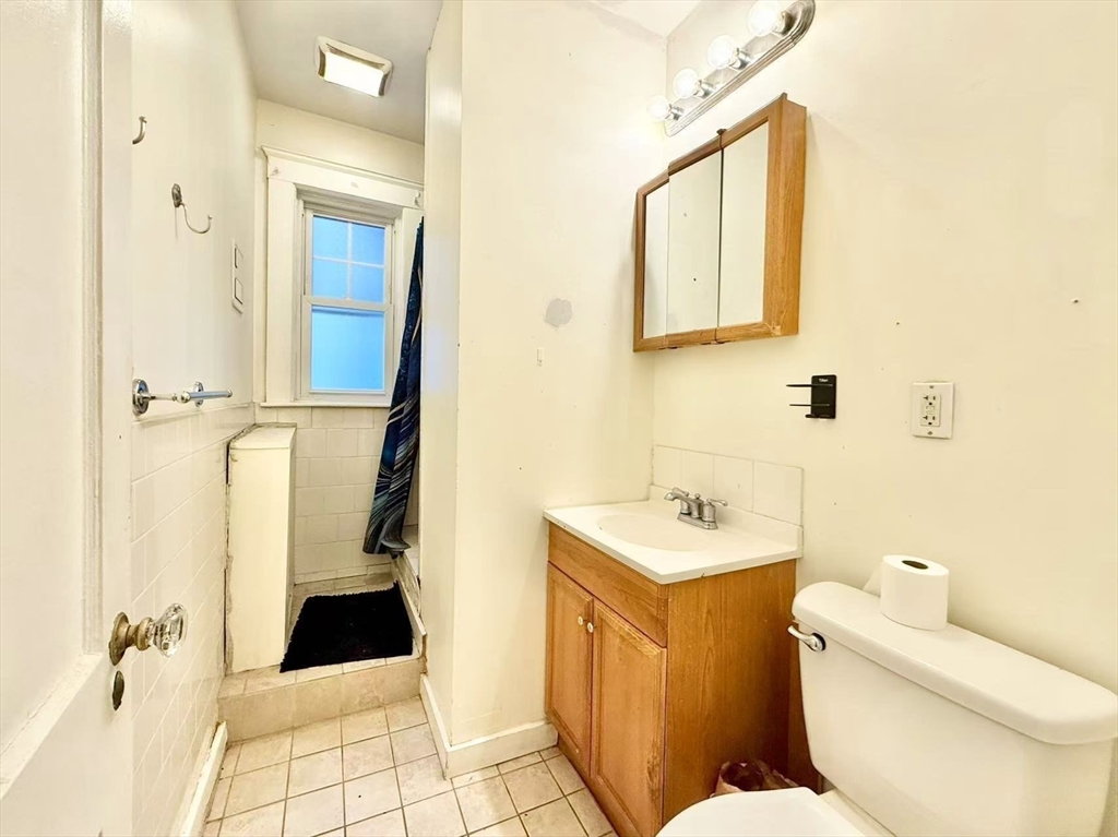 26 Chiswick Road, Unit 6 Boston, MA 02135 - Photo 15 of 19 a bathroom with a sink toilet and shower