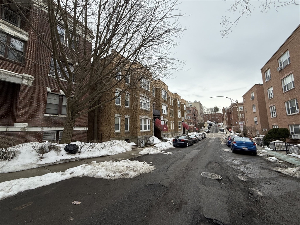 26 Chiswick Road, Unit 6 Boston, MA 02135 - Photo 17 of 19 a row of cars parked on the side of a street