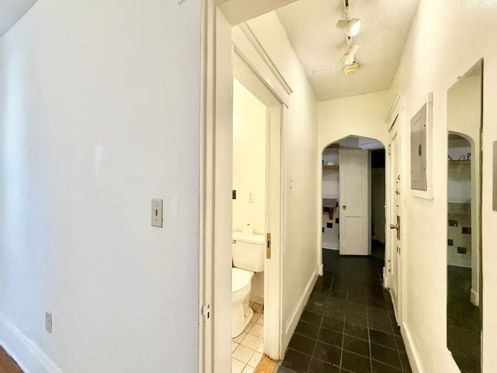 26 Chiswick Road, Unit 6 Boston, MA 02135 - Photo 2 of 19 a view of a hallway with wooden floor and staircase