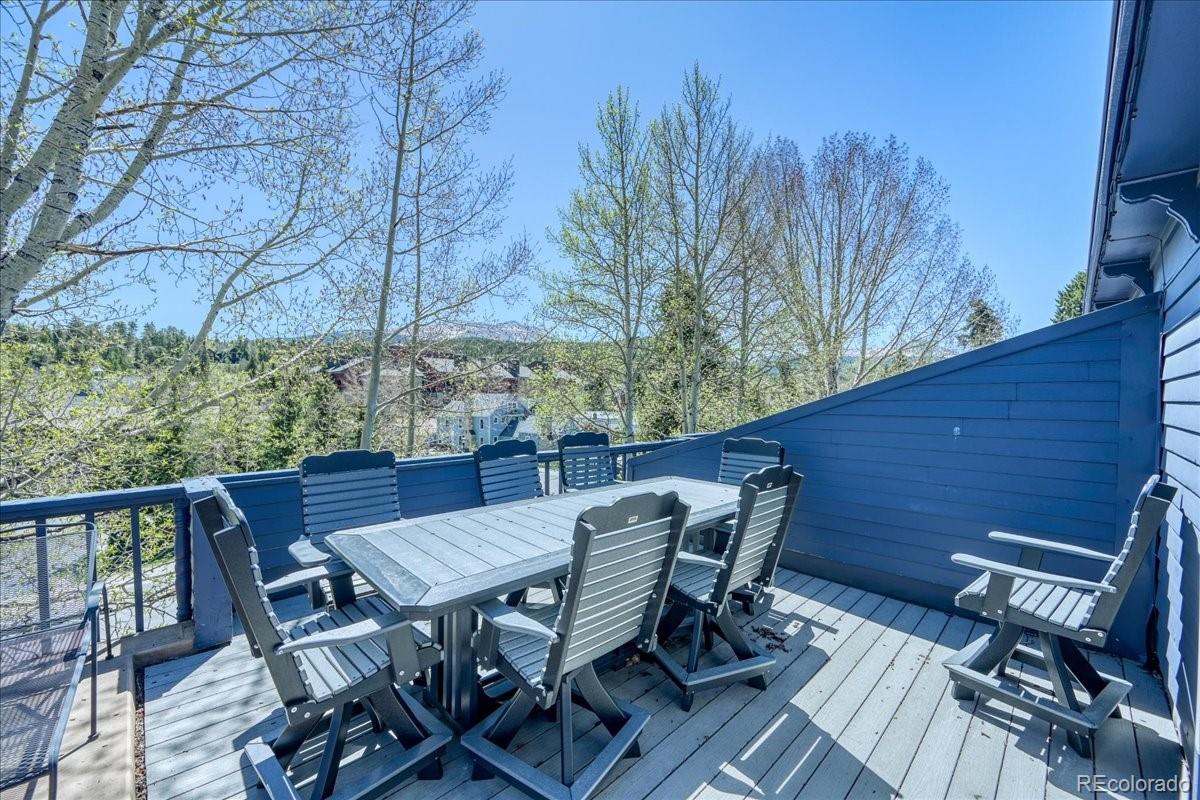 200 North Ridge Street, Unit R1 Breckenridge, CO 80424 - Photo 26 of 27 a view of a patio with table and chairs with wooden floor and fence
