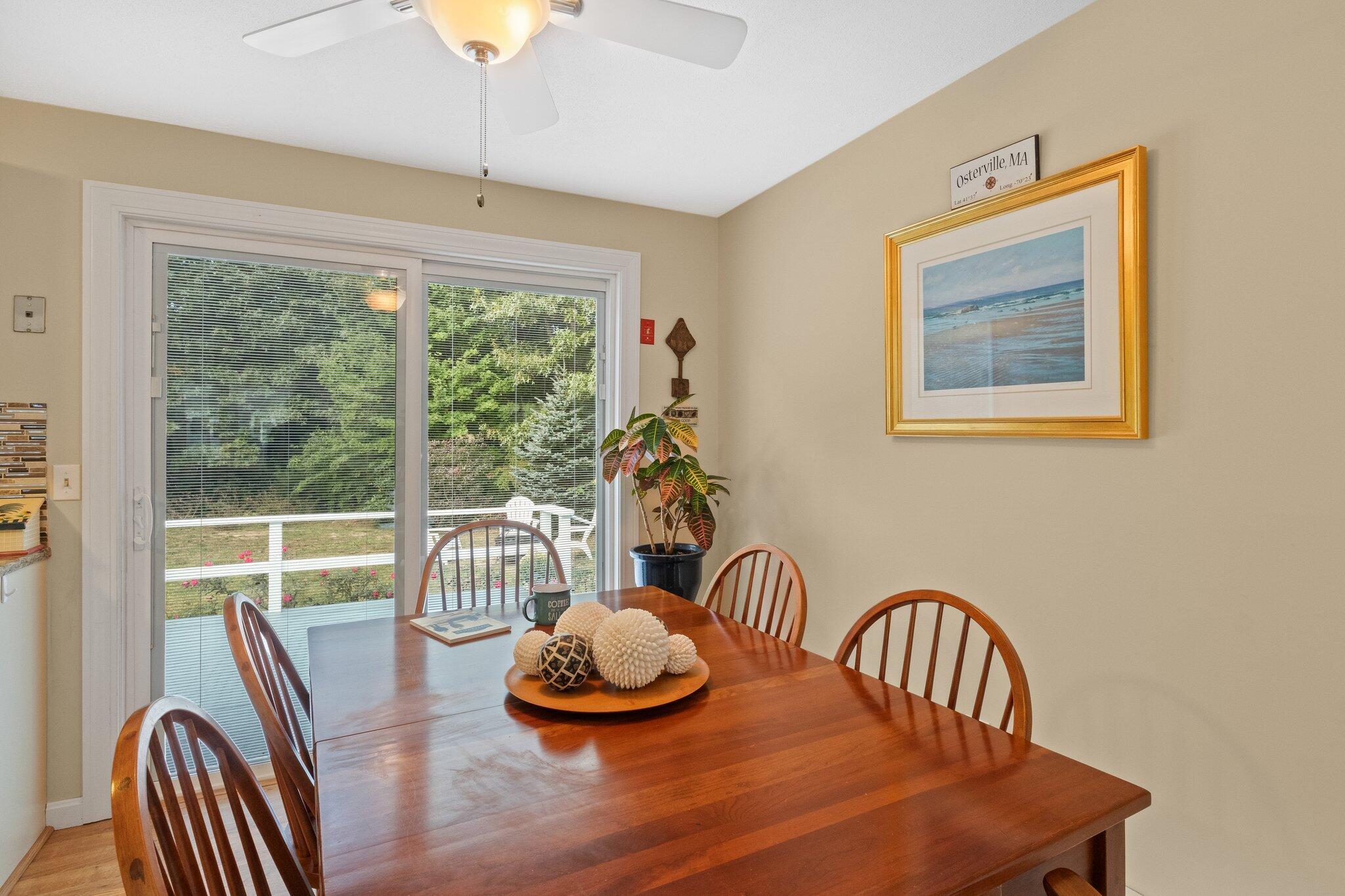 99 East Osterville Road Osterville, MA 02655 - Photo 15 of 43 a dining room with furniture a rug and wooden floor