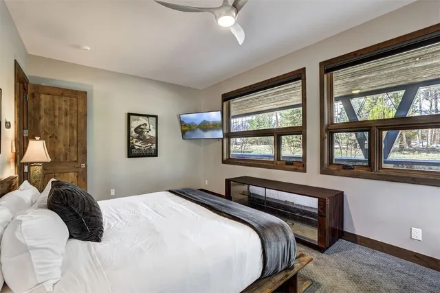 a bathroom with a granite countertop sink mirror vanity and toilet
