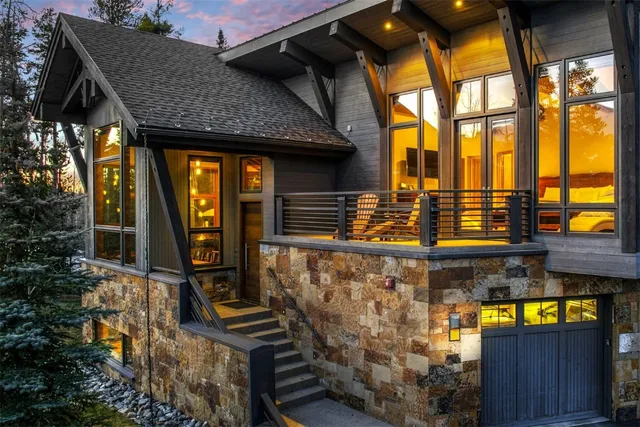 a front view of a house with large windows